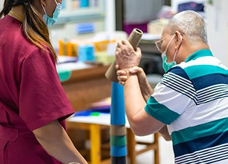 Occupational therapy: hand function training in stroke patient by using stacking cone at a therapy room in the hospital
